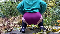 Hot mature woman in leggings pees standing doggystyle