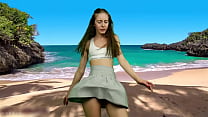 She's dancing on the beach without panties