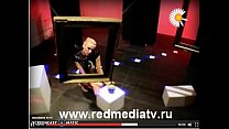 Svetlana Demeschenko looking through a picture frame and stripping