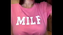 MILF with big tits in a pink T-shirt