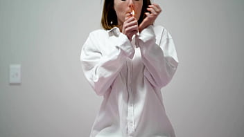 Playful Brunette Smoking in White Blouse and Bra