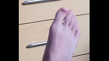 white boy playing with his delicious foot