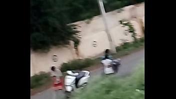 Lovers kissing on road
