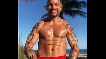 OUTSIDE AT BEACH FLEXING