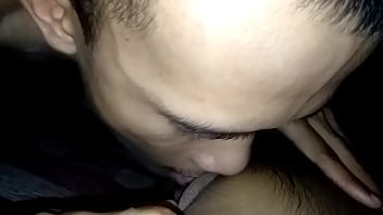Spreading Thai girl's pussy and fucking her clit
