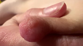 Female breast milk and nipple close up