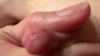 Female breast milk and nipple close up