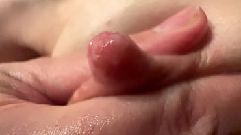 Female breast milk and nipple close up