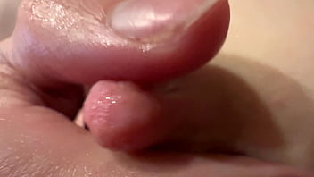 Female breast milk and nipple close up