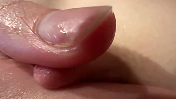 Female breast milk and nipple close up