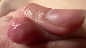 Female breast milk and nipple close up