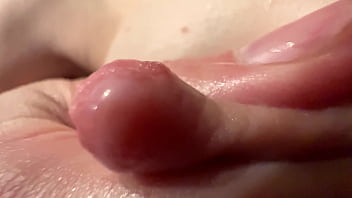 Female breast milk and nipple close up