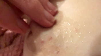 Female breast milk and nipple close up
