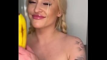 Horny college girl sucks on a banana