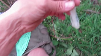 thumb drinking sperm  from a condom  