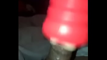 Small black dick plays with toy