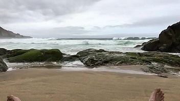 thumb self pee at a n  ude beach  