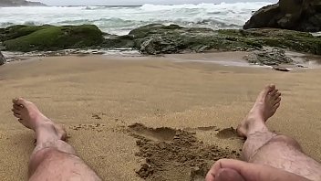 thumb self pee at a n  ude beach  