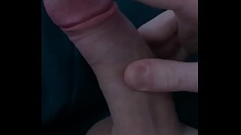 Toying with an uncut shaven cock