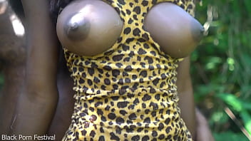 2 African tribe girl having fun with the village chief in the middle of the forrest