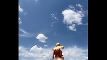 Sexy stepmother walks naked in the field