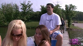 thumb applying suntan  oil to bare tits  ts 