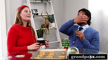 thumb grandpa dressed  as santa gives her a present   her a present her a present sh