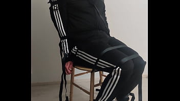 Boy bound to chair struggling