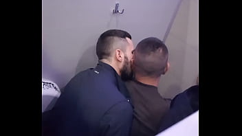2 men having fun in a public toilet