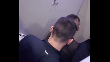2 men having fun in a public toilet