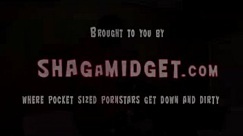 Midget gives a standing blowjob