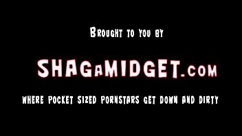 Midget gives a standing blowjob