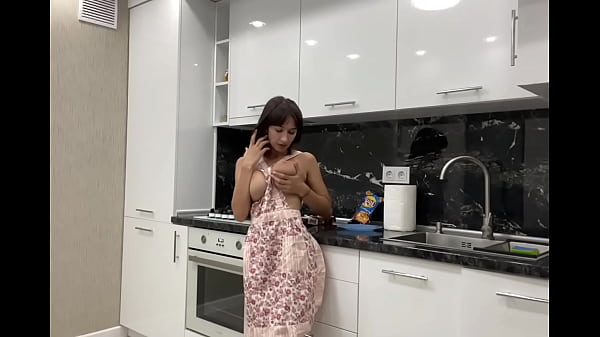 Stunning busty bitch masturbates in the kitchen before her lover arrives