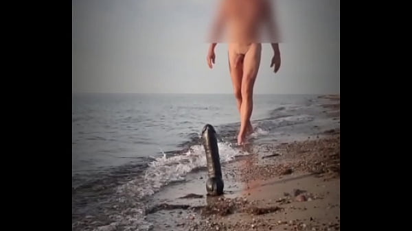 Beach Ride On A BigBlackDildo