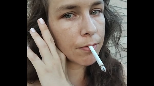 Kelly Kendricks smokes cigarettes in the sun with lots of cleavage Thumbnail