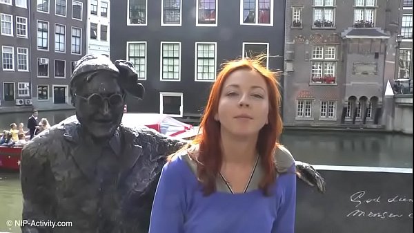 Pretty redhead walking naked in Amsterdam