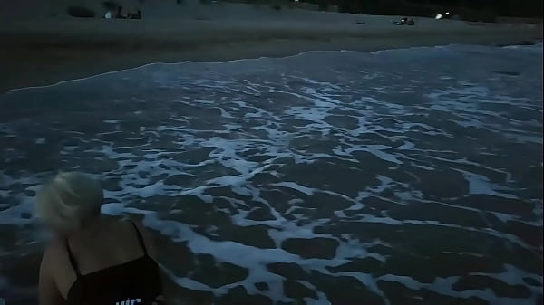 Blonde shows tits and sucks cock on a public beach