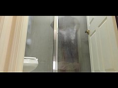 - Brown man taking a shower
